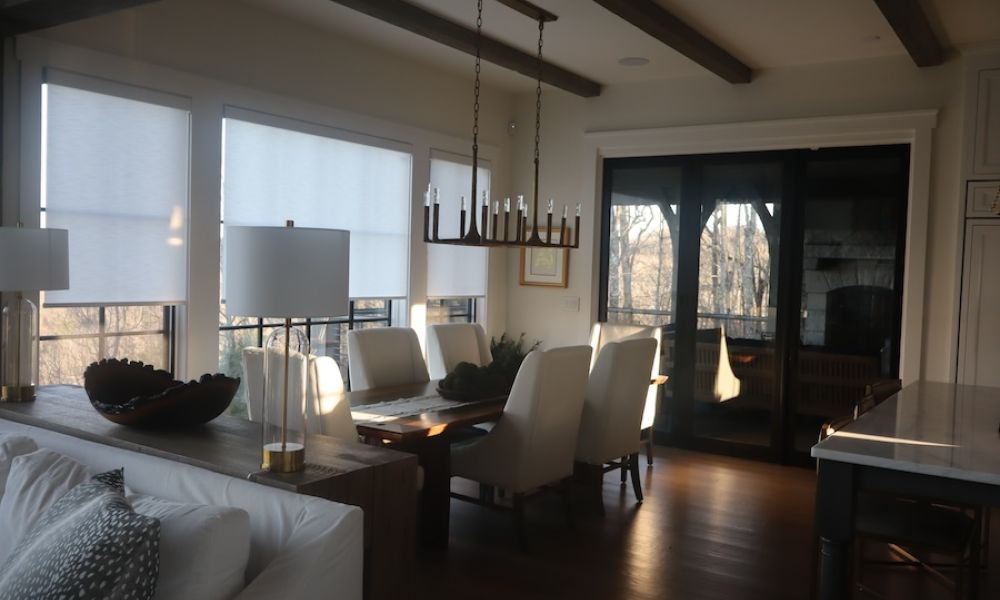 Luxury living room with partially lowered motorized shades.